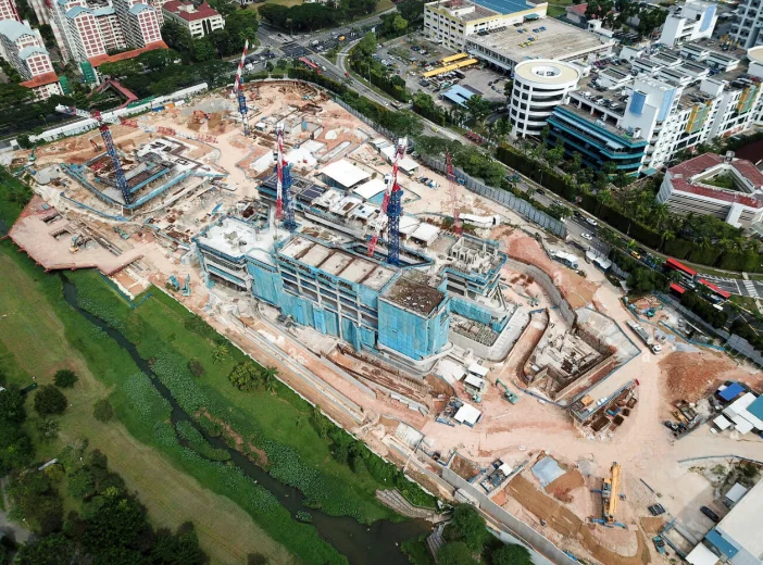 Monthly aerial construction progress photograph of a Singapore development